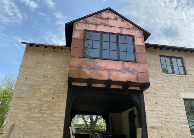Copper metal panel facade on a stone building for Skylight Installation in Swatara